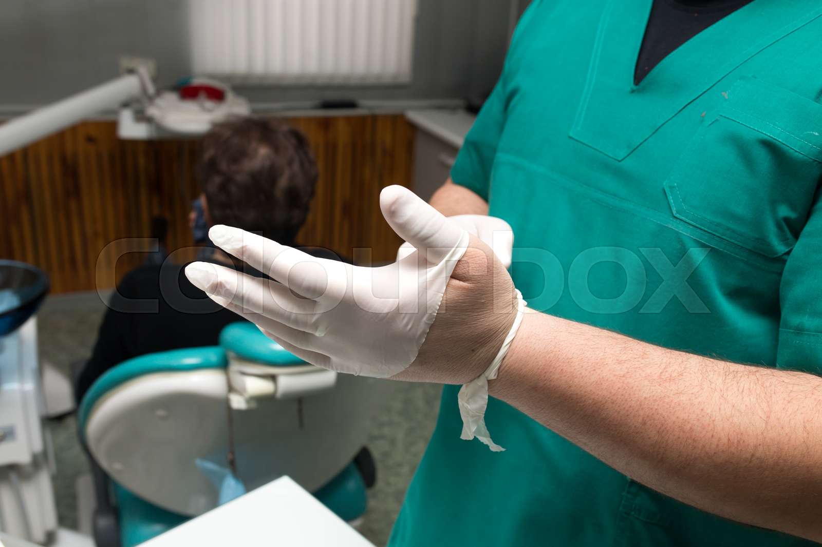 Doctor Dentist Puts On White Gloves In The Clinic Stock Image Colourbox Doctor Dentist Puts On White Gloves In The Clinic Stock Image Colourbox