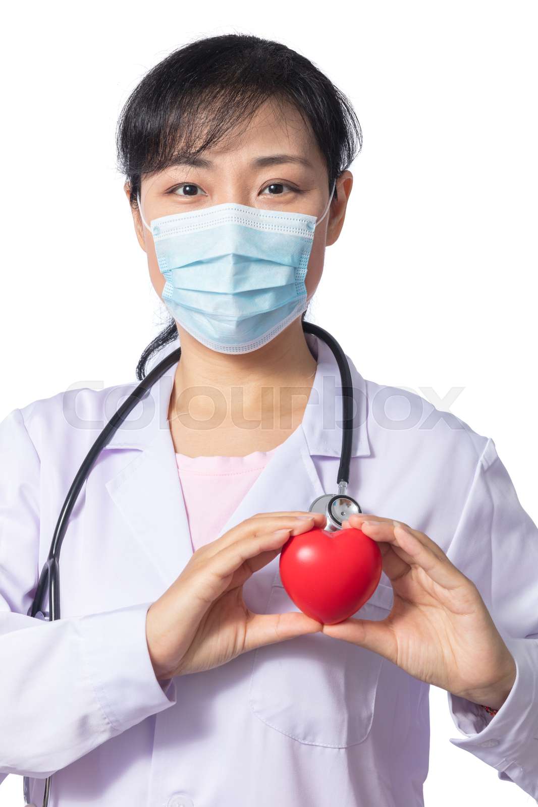 Asian female doctor holding red heart with stethoscope | Stock image ...