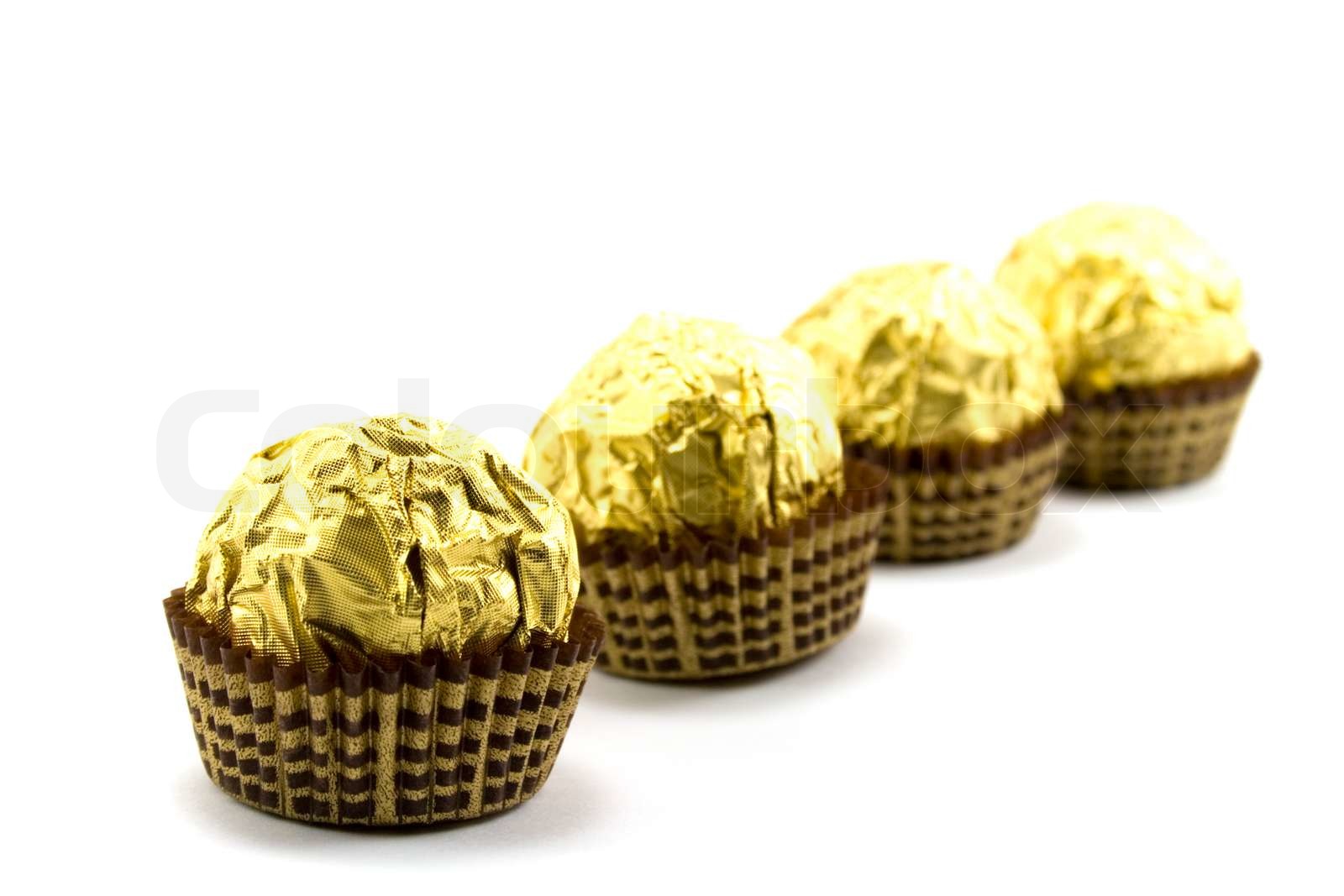gold chocolate ball on white Stock image Colourbox