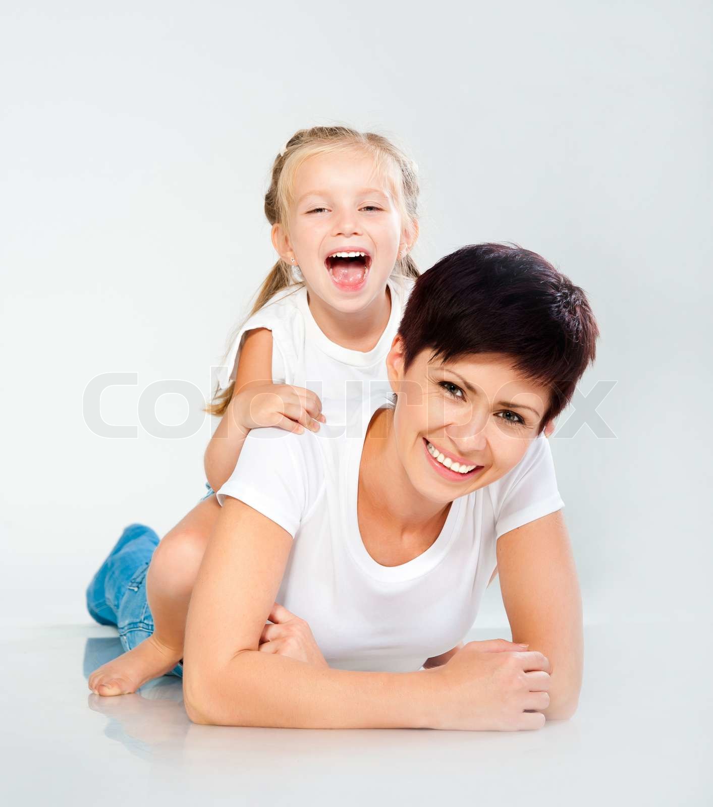Mother And Daughter Laughing And Looking At Camera Stock Image Mother And Daughter Laughing And Looking At Camera Stock Image