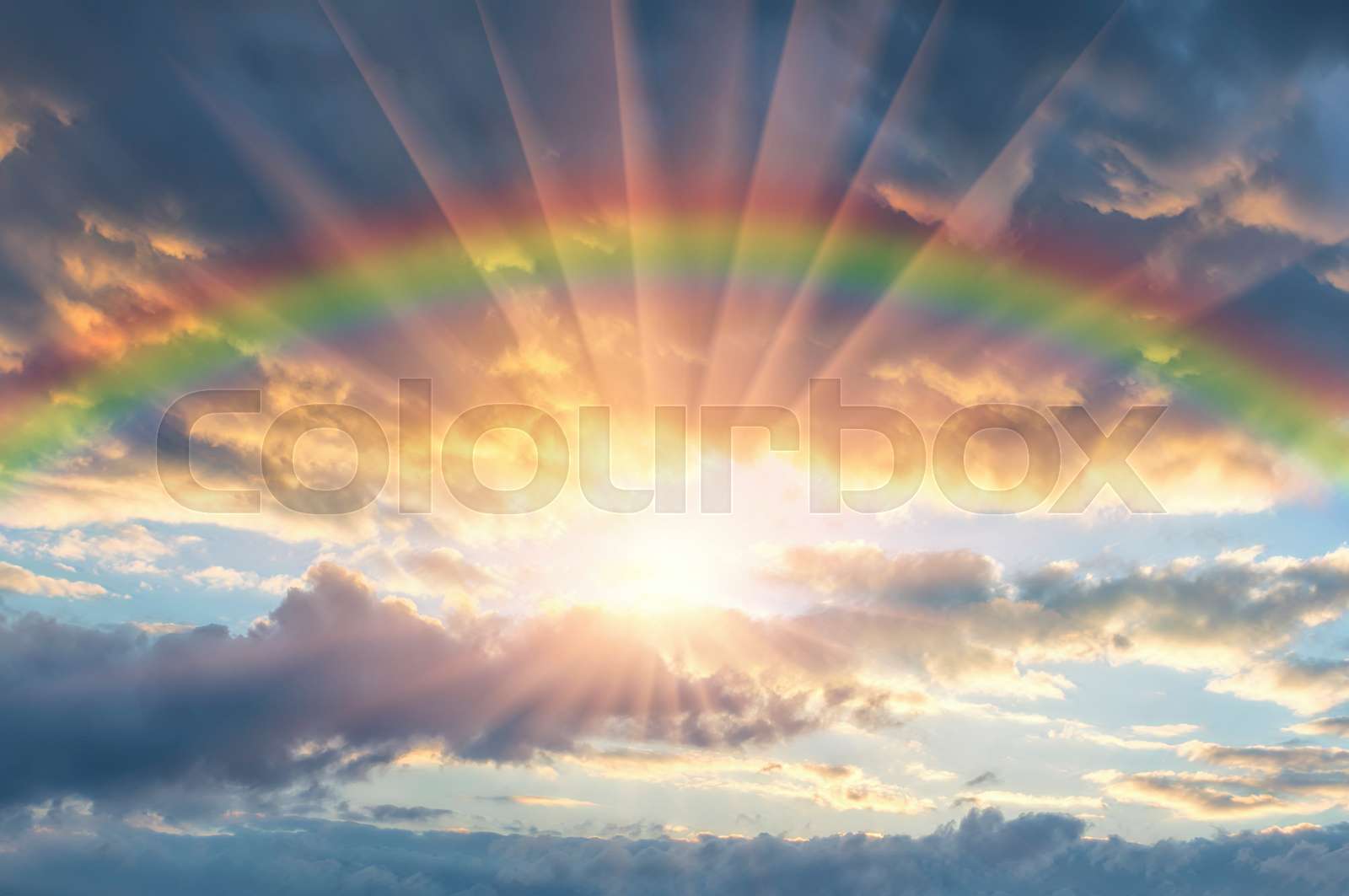 Beautiful sunset with a rainbow | Stock image | Colourbox