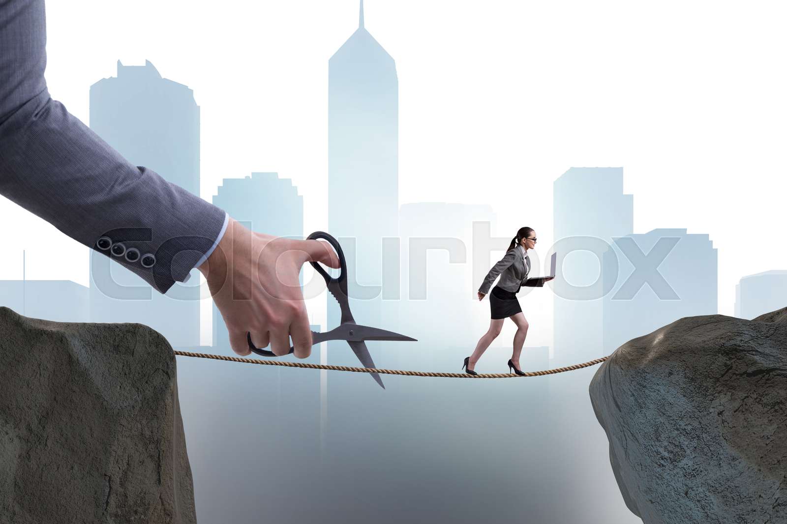 Hand cutting the rope under businesswoman tightrope walker | Stock ...