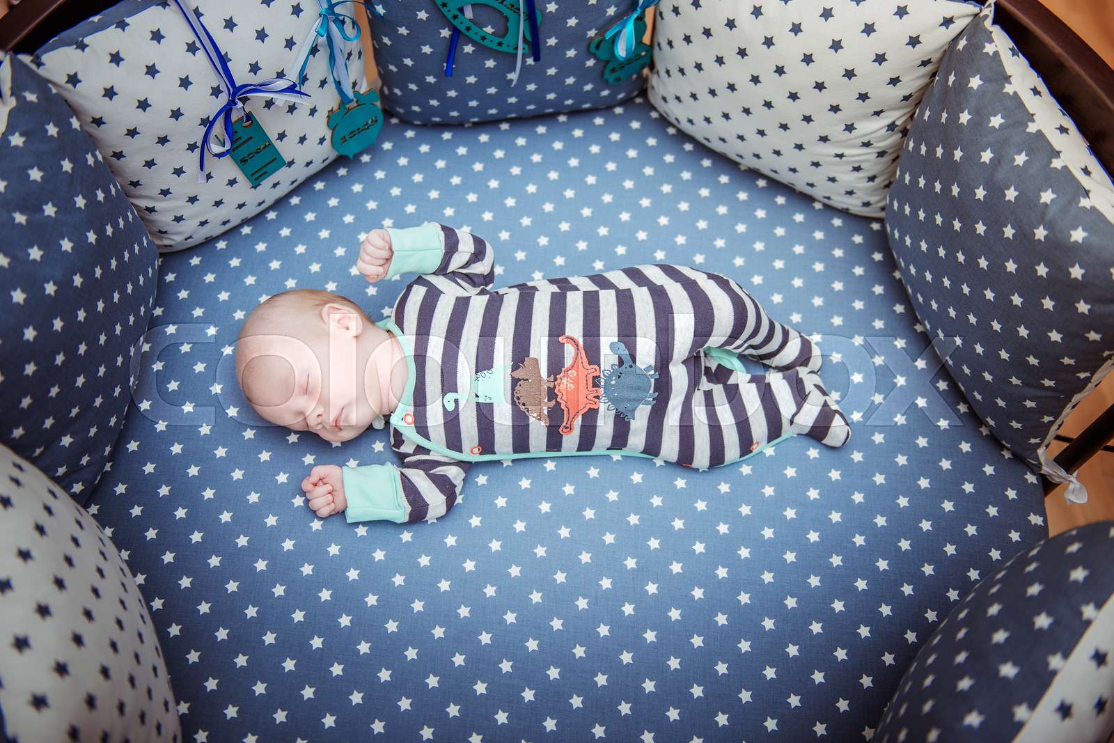 newborn baby sleeping on the bed Stock image Colourbox