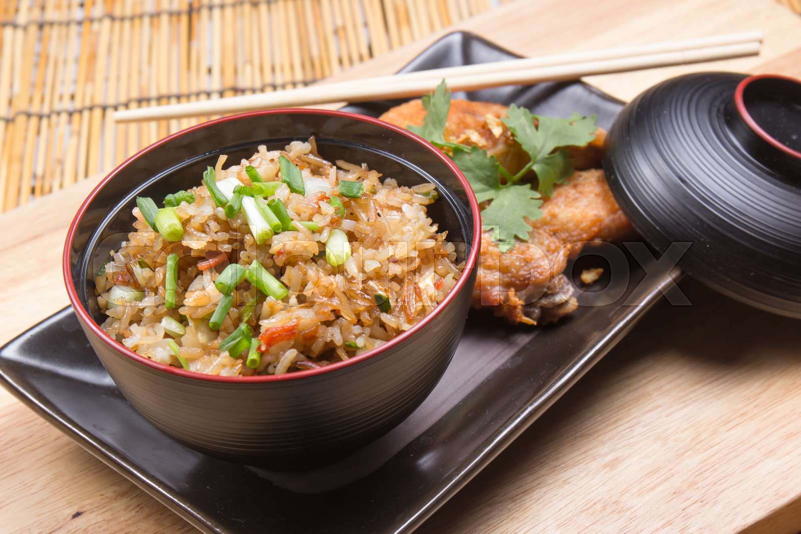 Fried chicken wings served with fry rice | Stock image | Colourbox