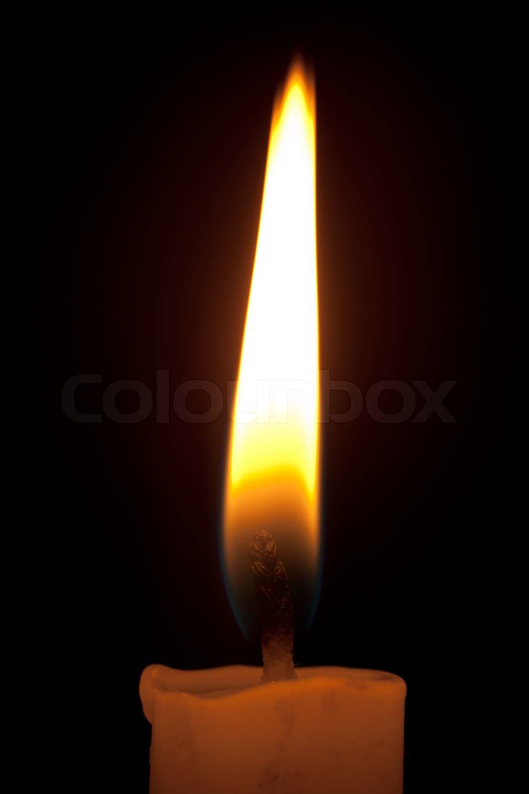 Close up view of the flame of candle Stock image Colourbox