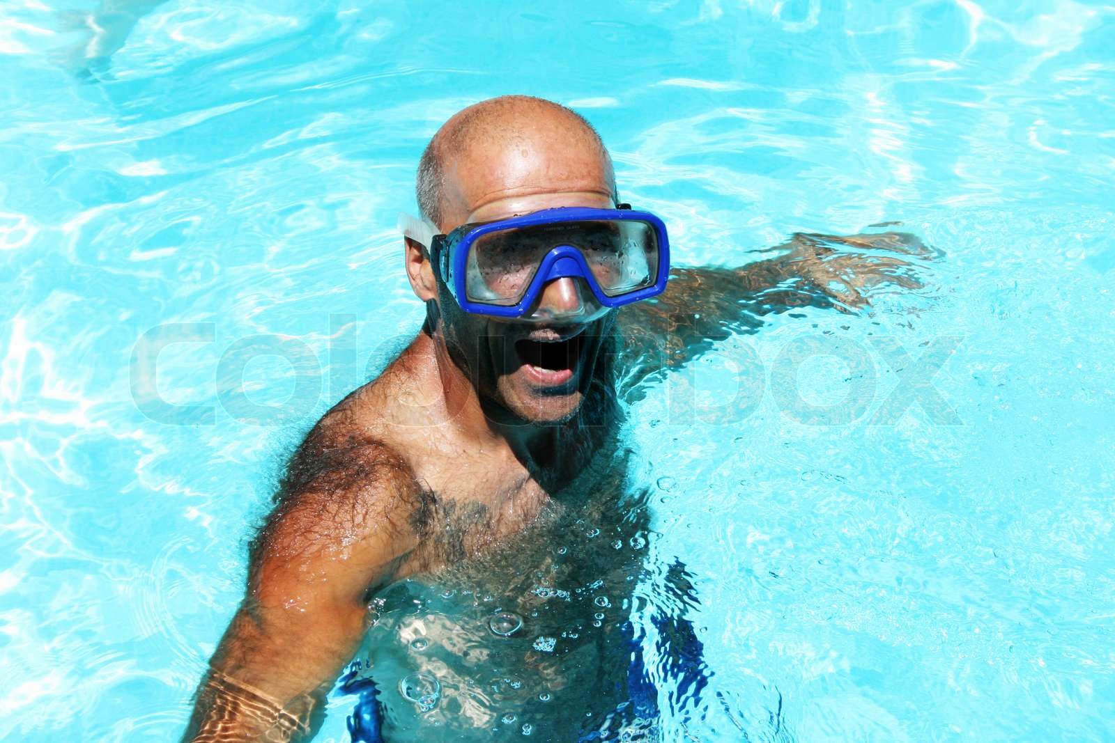 Man having fun in swimming pool. | Stock image | Colourbox