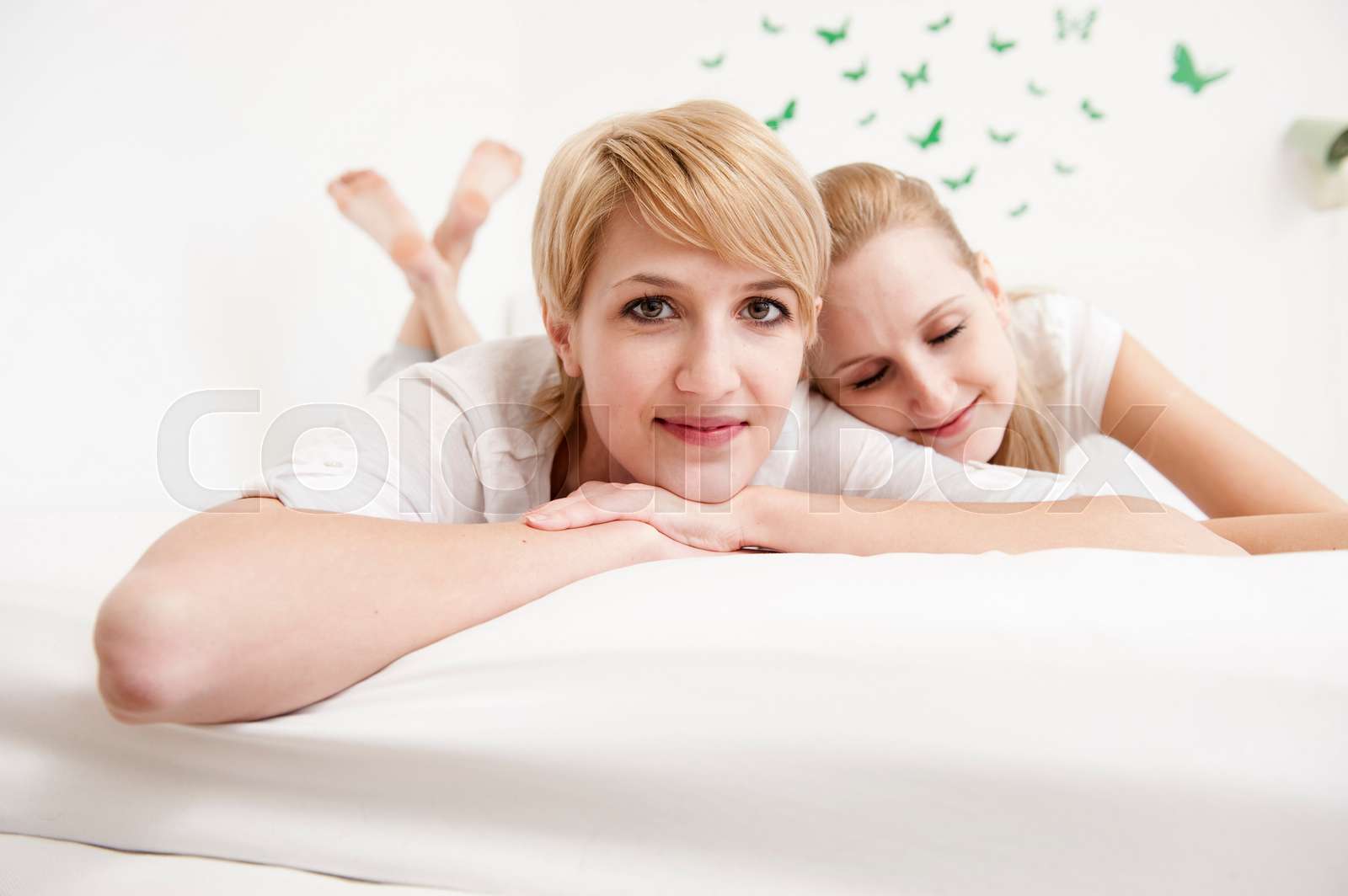 Women Lying On Bed Stock Image Colourbox