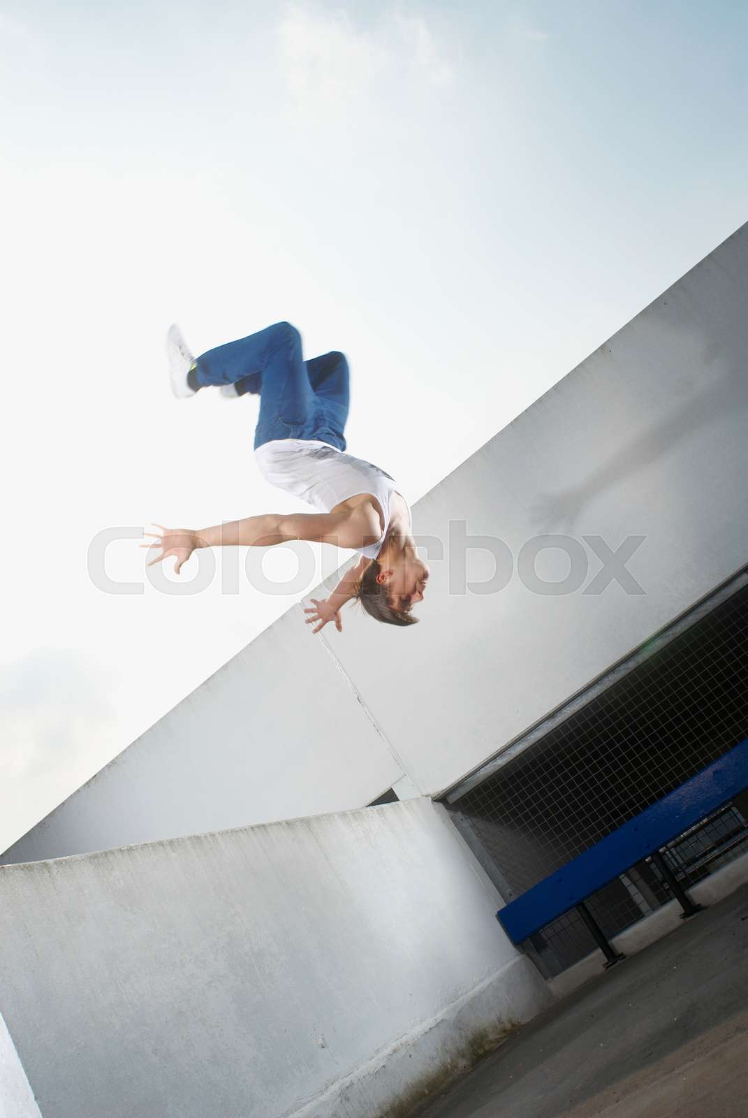 Man jumping on urban rooftop Stock image Colourbox