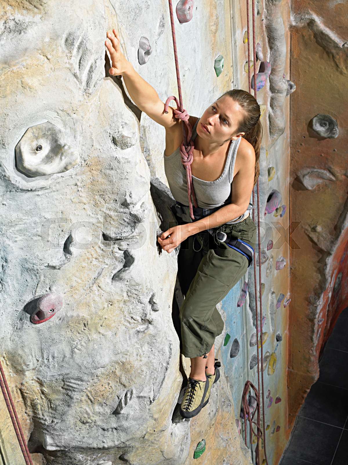 Woman on climbing wall Stock image Colourbox