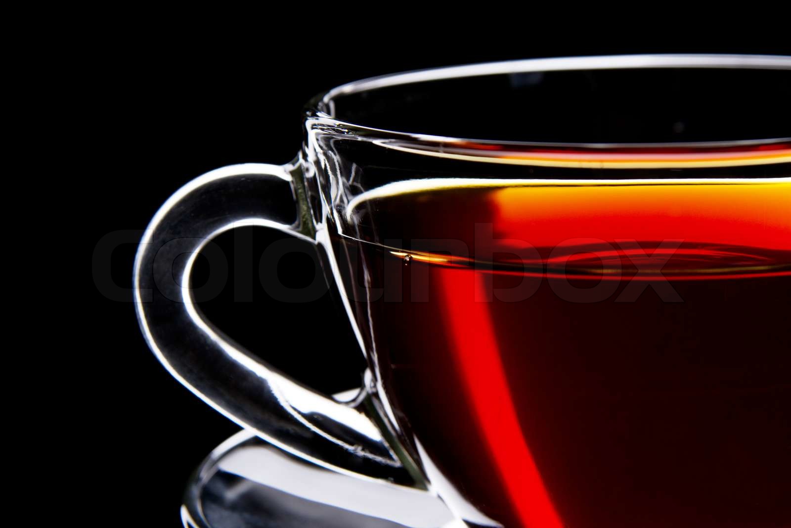 Cup of black tea isolated on black background | Stock image | Colourbox
