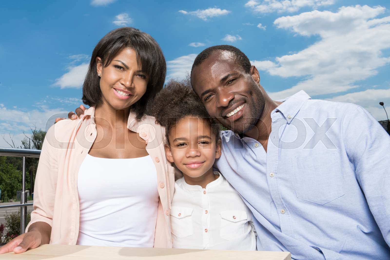 beautiful african-american family bonding outdoors | Stock image
