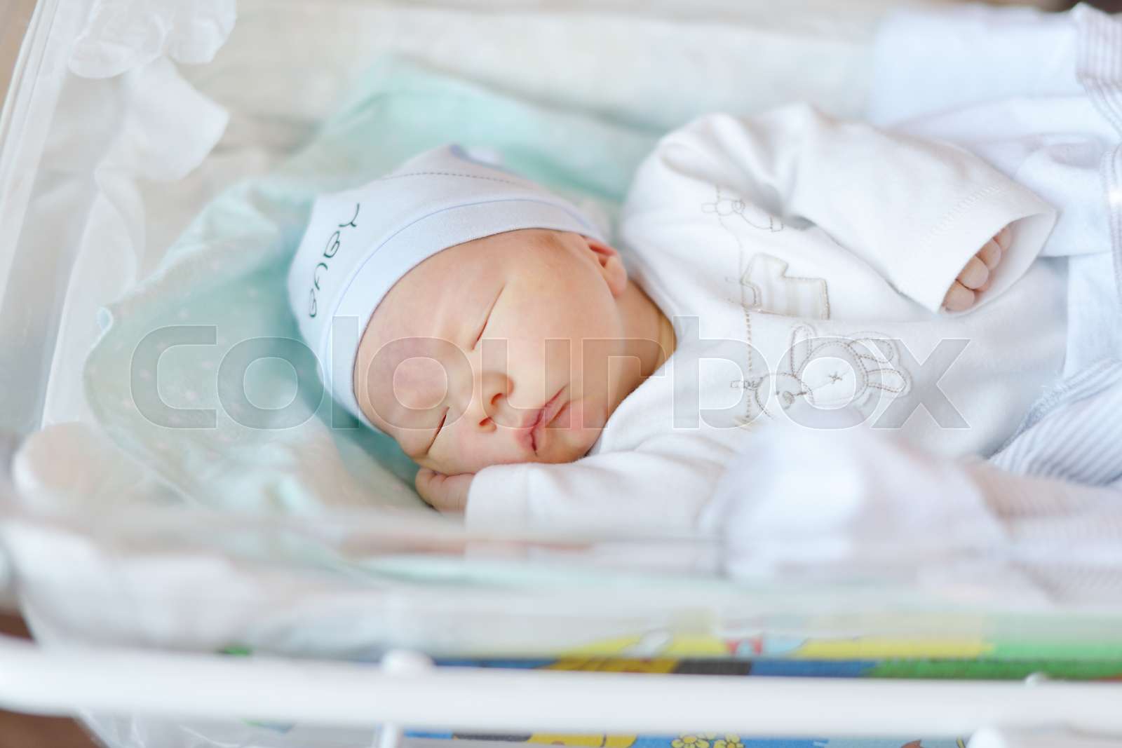 newborn in crib Stock image Colourbox
