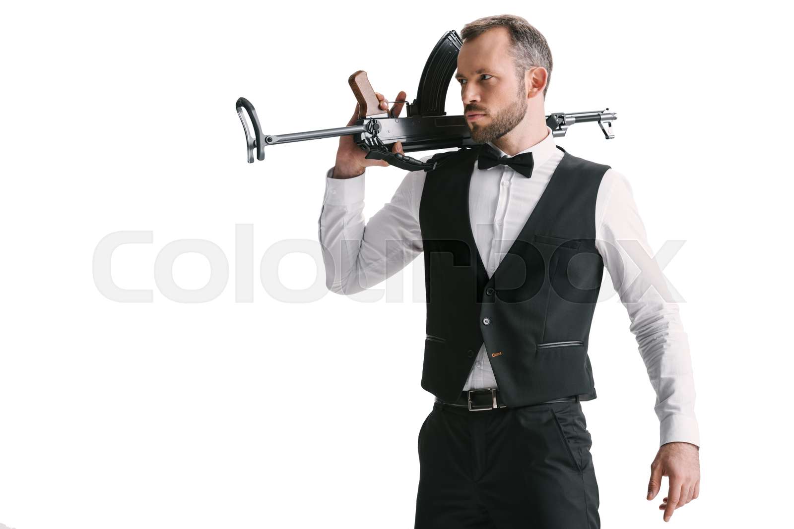 secret agent in suit with rifle | Stock image | Colourbox