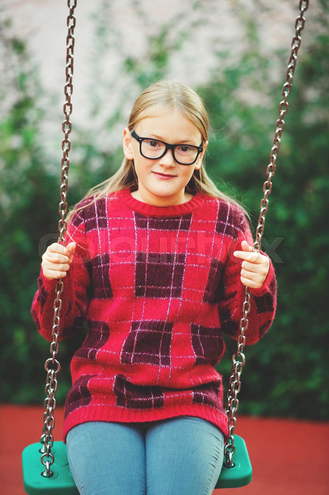 Outdoor Portrait Of A Cute Little 9 Year Old Girl Wearing Eyeglasses