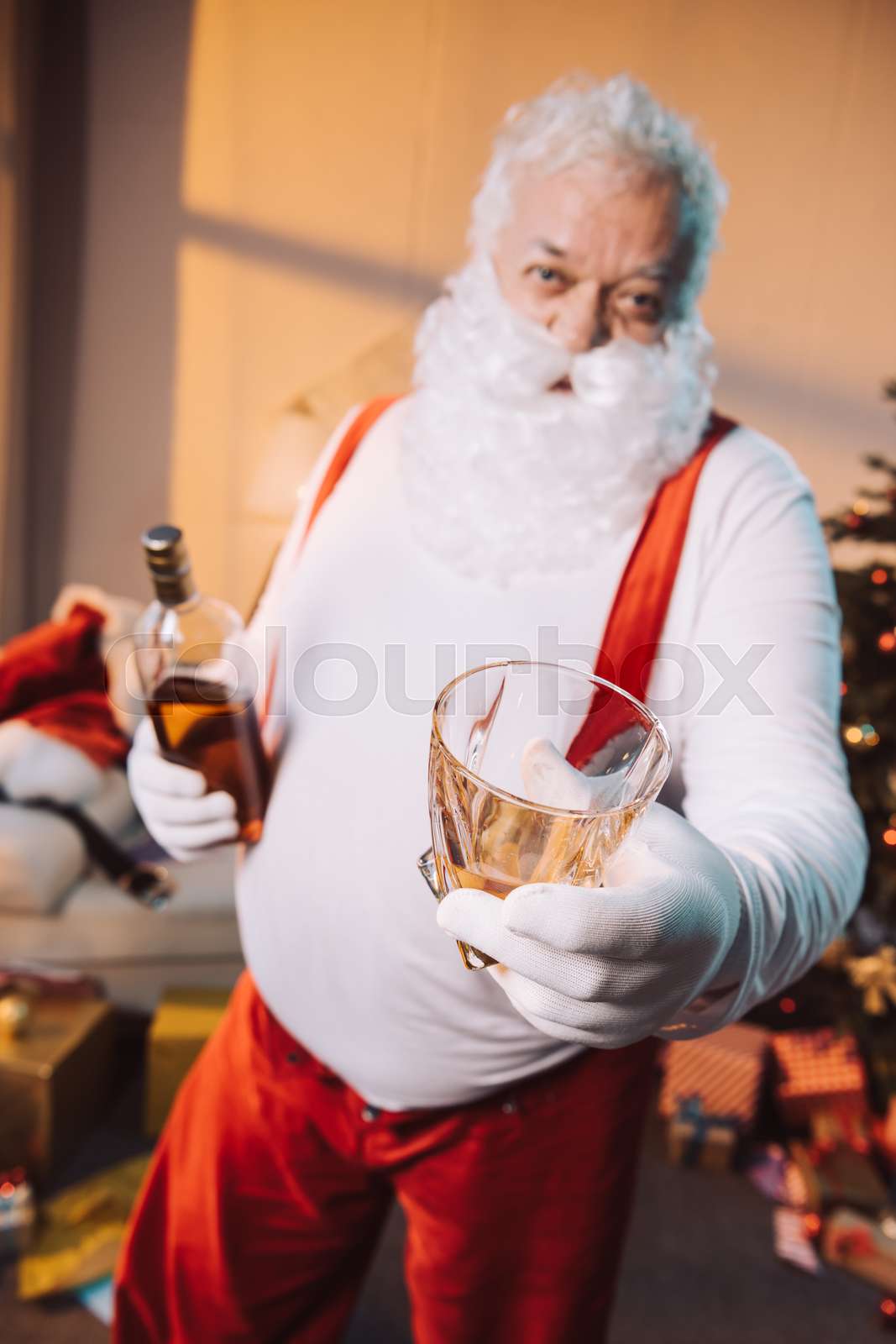 santa claus holding bottle of whiskey | Stock image | Colourbox