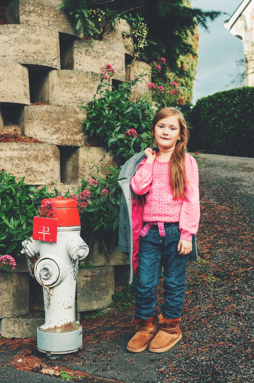 Outdoor portrait of pretty little 7 year old girl wearing pink pullover.  Autumn fashion for children | Stock image | Colourbox