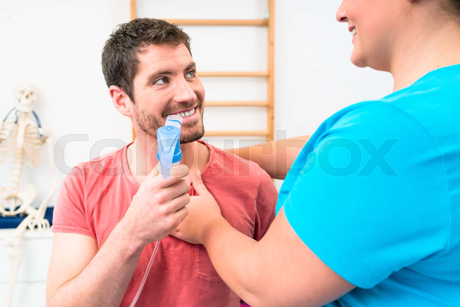 Man taking pulmonary function test with mouthpiece in his hand | Stock ...