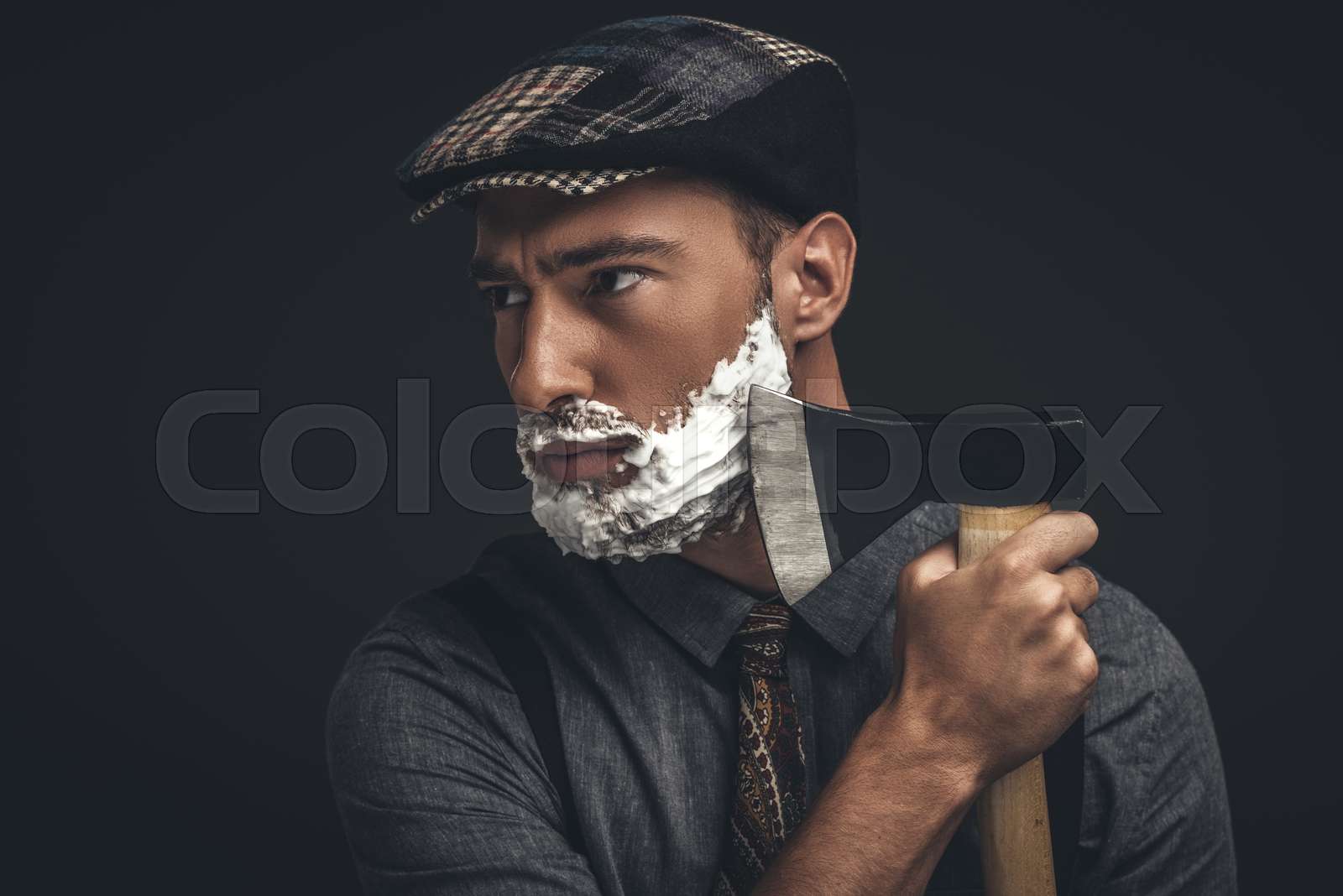 man shaving with axe Stock image Colourbox