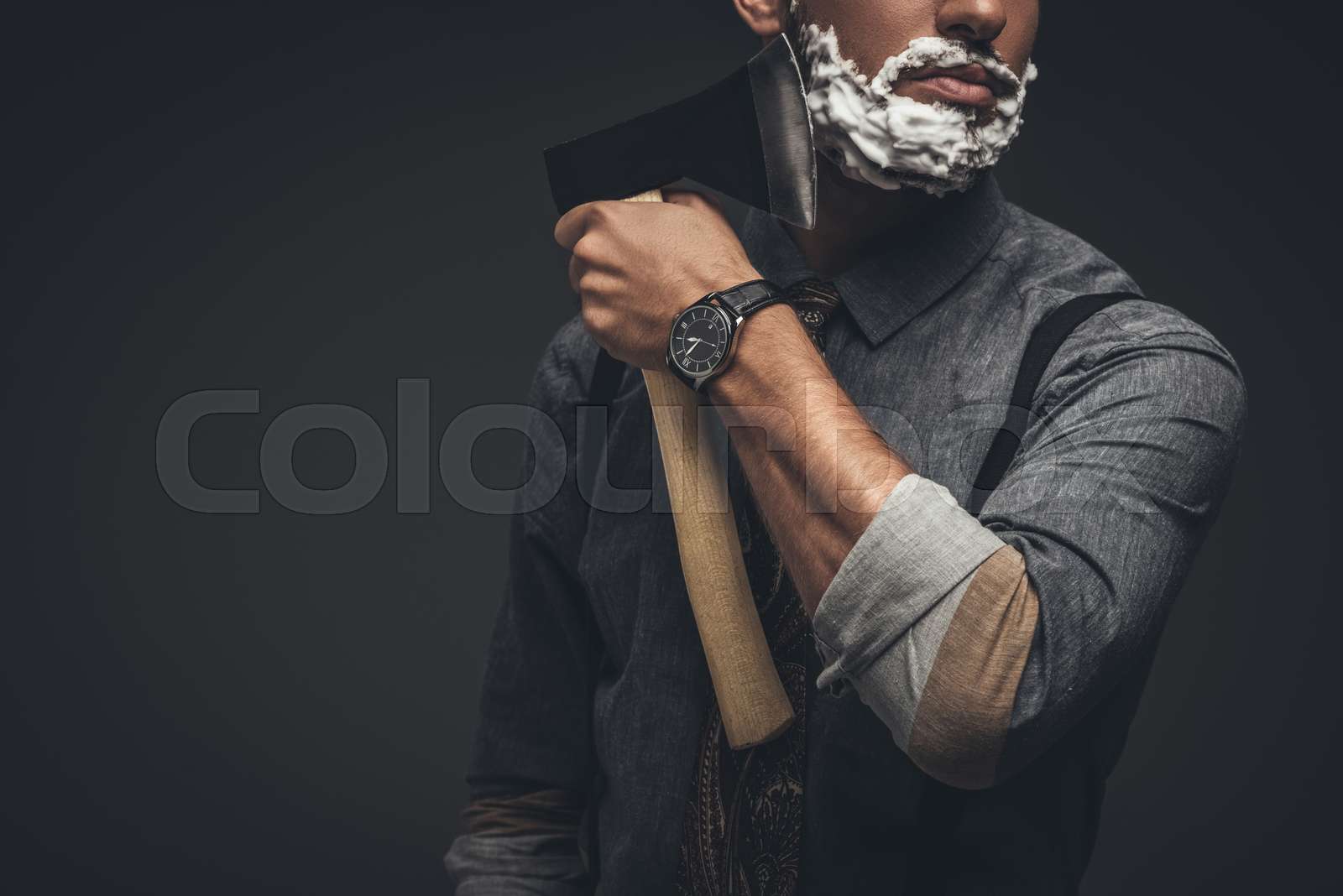man shaving with axe Stock image Colourbox