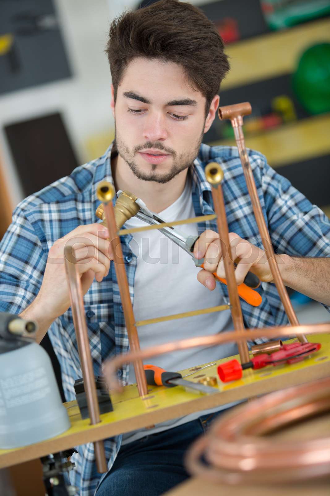 worker using propane gas torch for soldering copper pipes Stock image