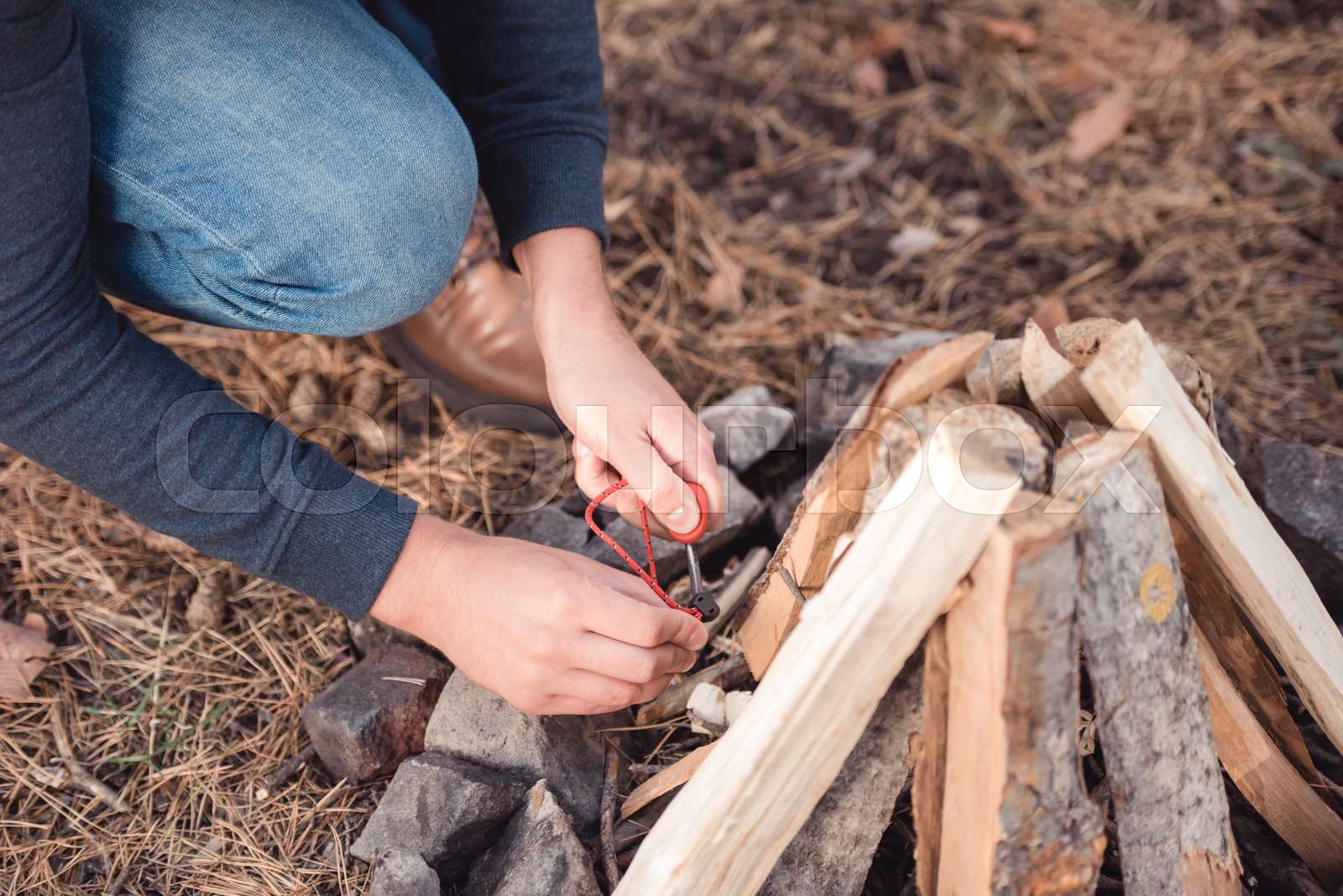 man kindling bonfire Stock image Colourbox