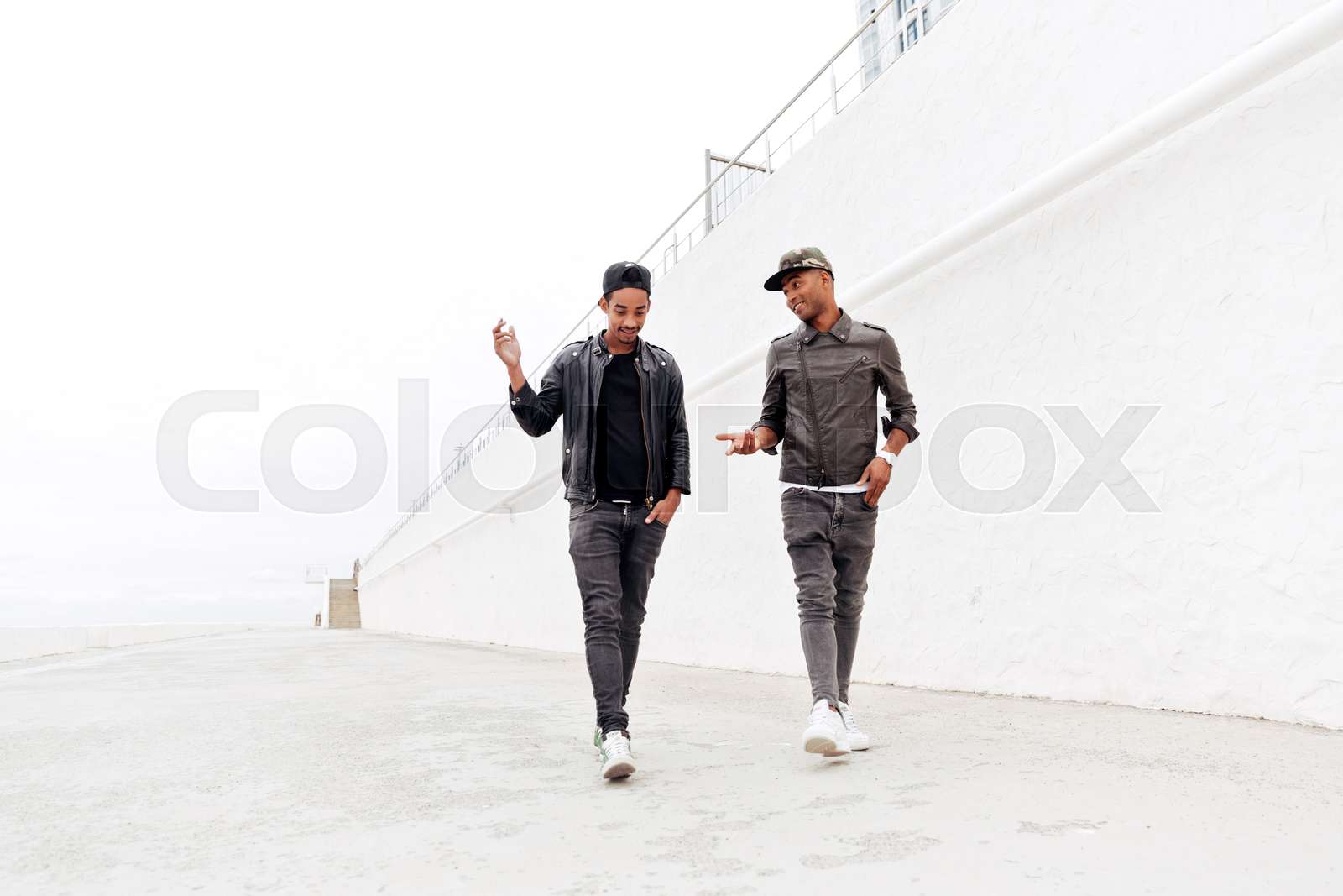 African men friends walking outdoors | Stock image | Colourbox