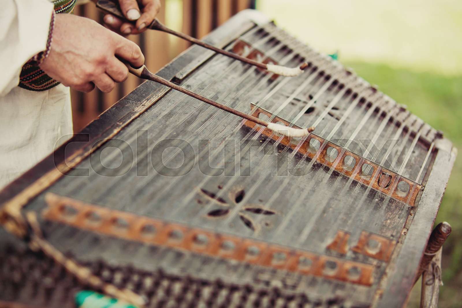 Ukrainian traditional music string instrument tsymbaly. Man wearing ...