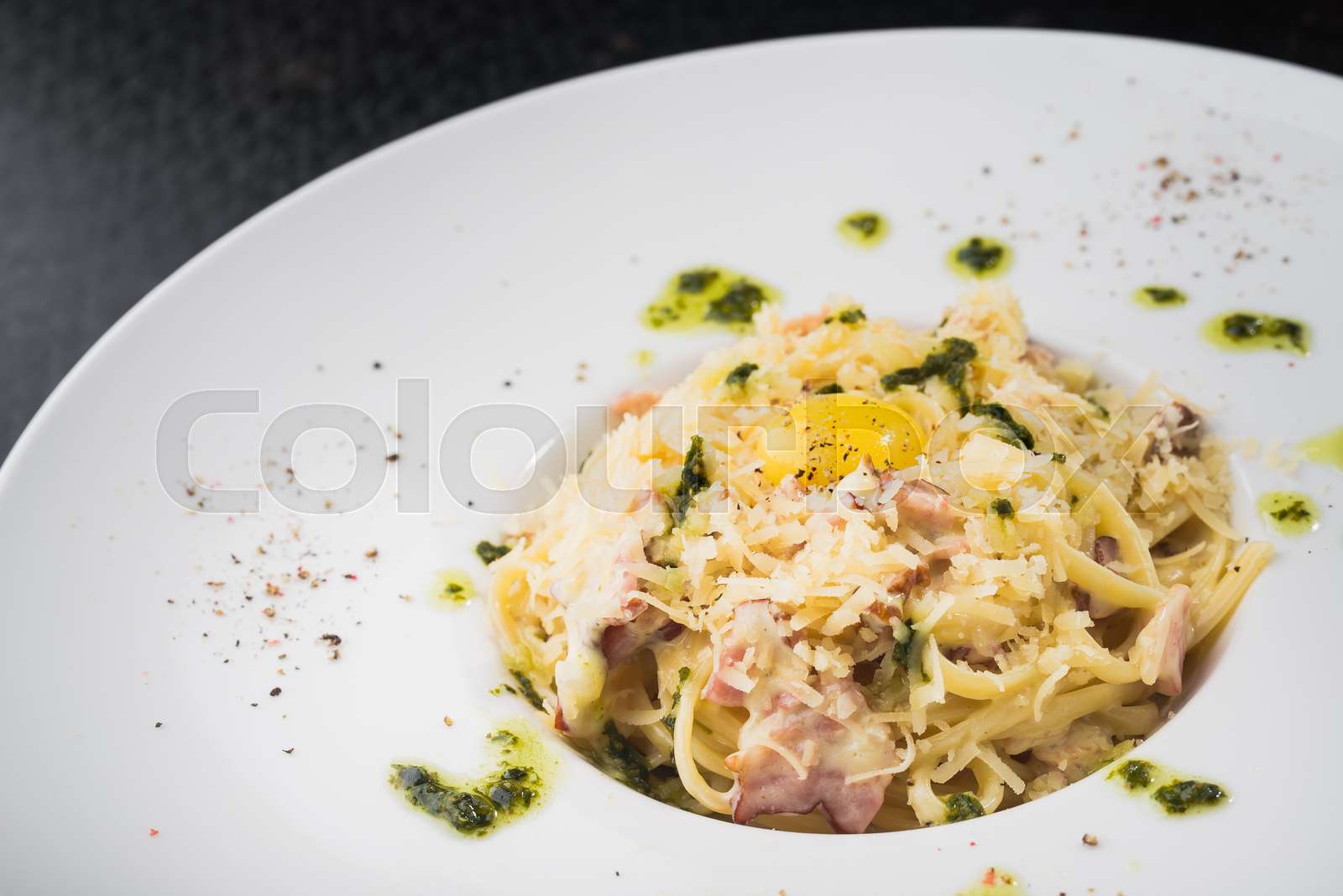 spaghetti carbonara with raw egg Stock image Colourbox