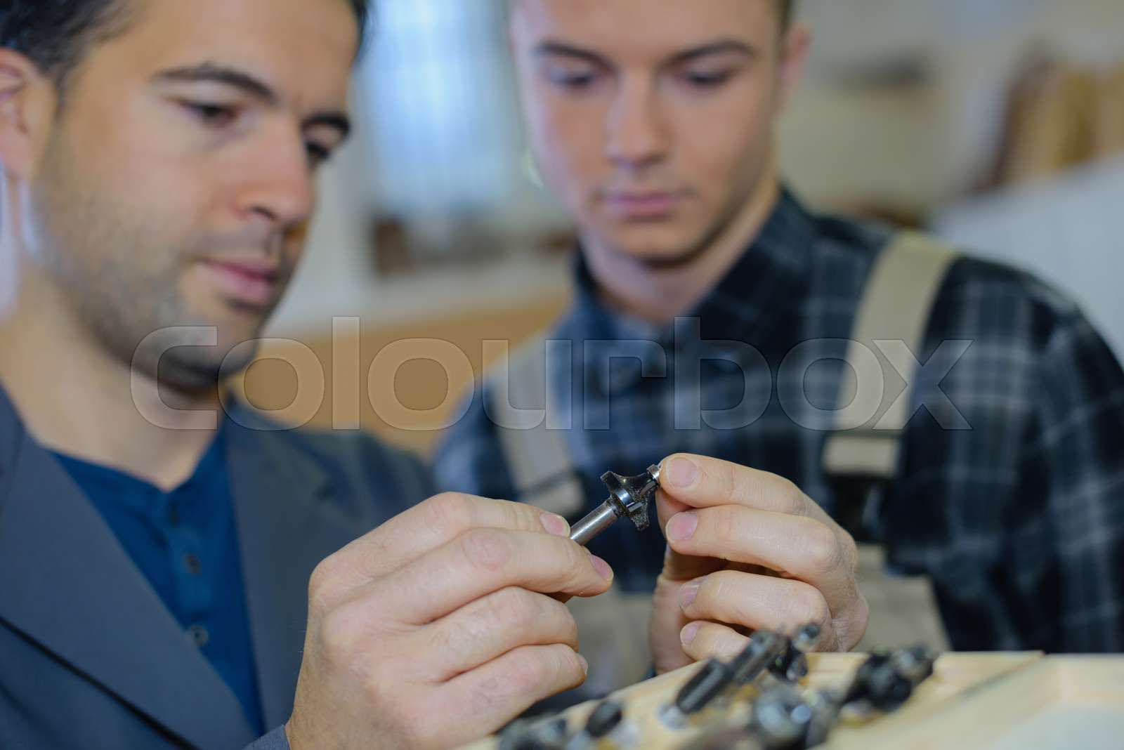 Men screwing a bolt stock image colourbox