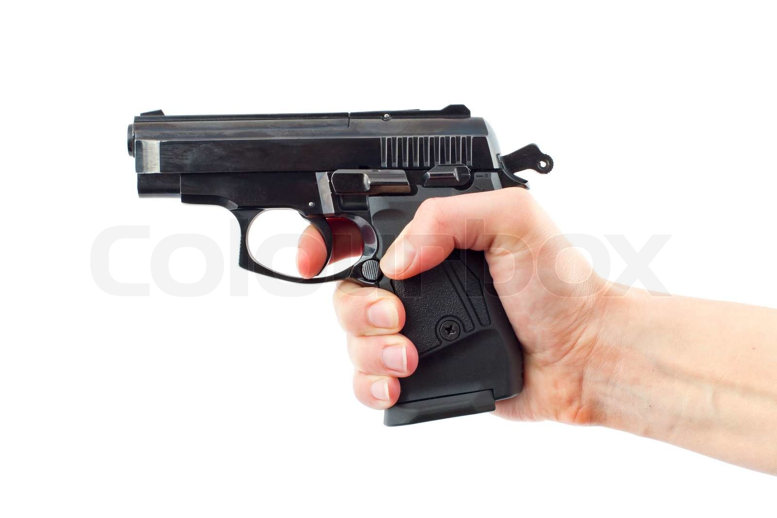 Hånd med pistol på hvid | Stock foto | Colourbox