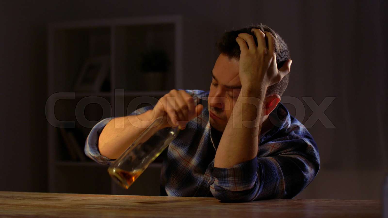 alcoholic drinking whiskey from bottle at home Stock video Colourbox