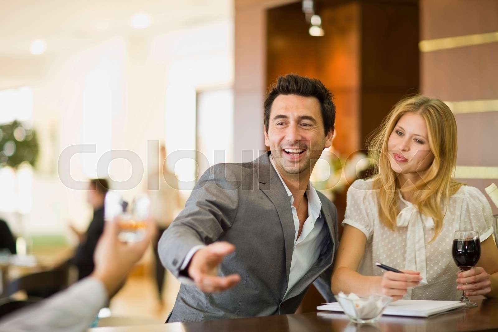 Couple sitting at bar Stock image Colourbox
