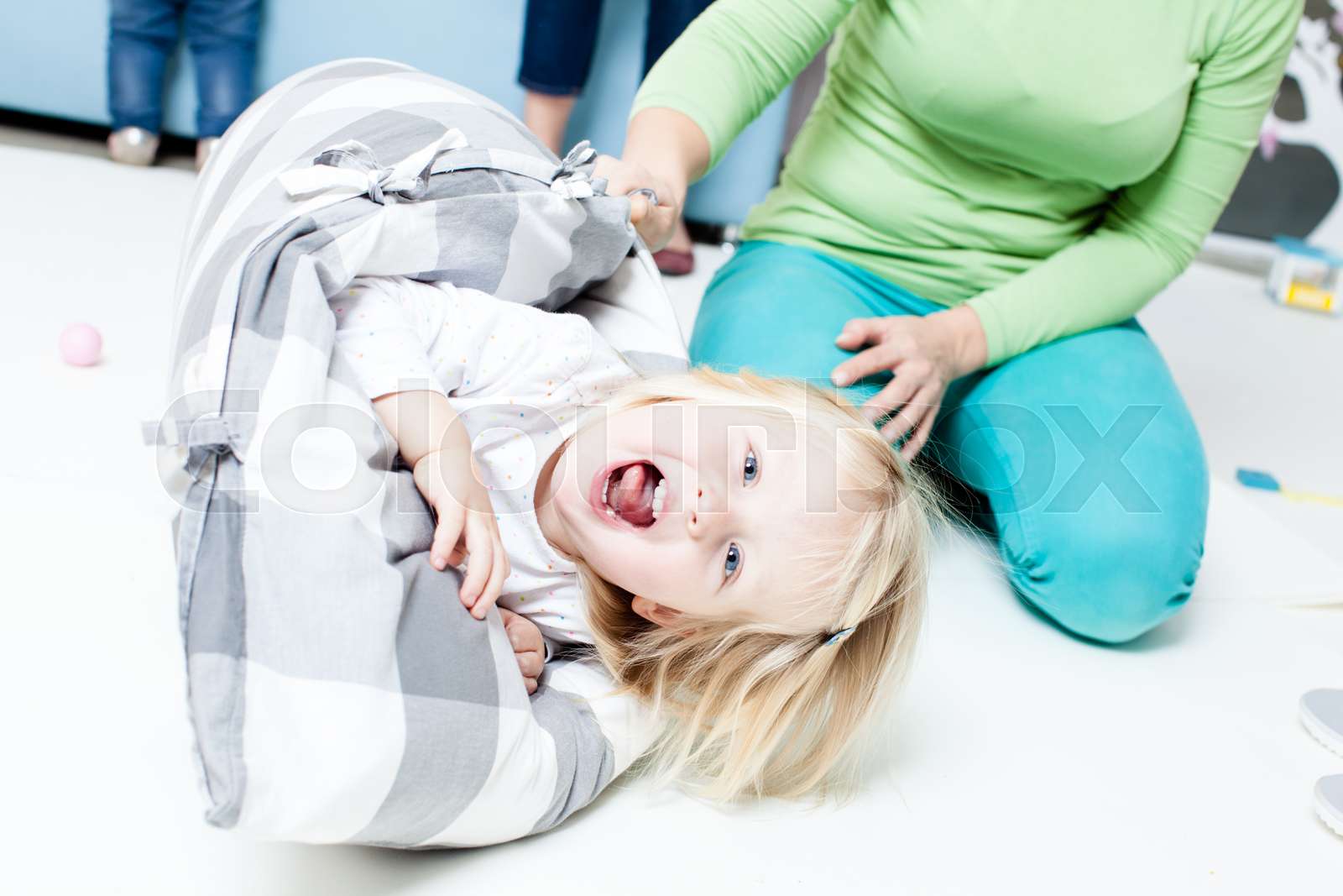 Mother is rocking her baby Stock image Colourbox