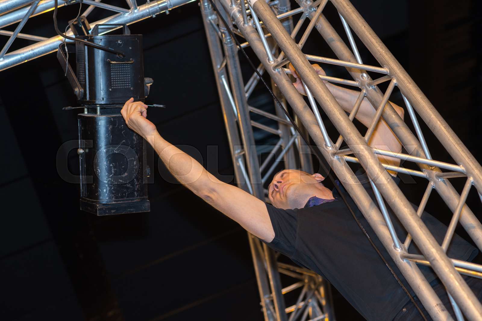professional stage lighting control technician at work Stock image