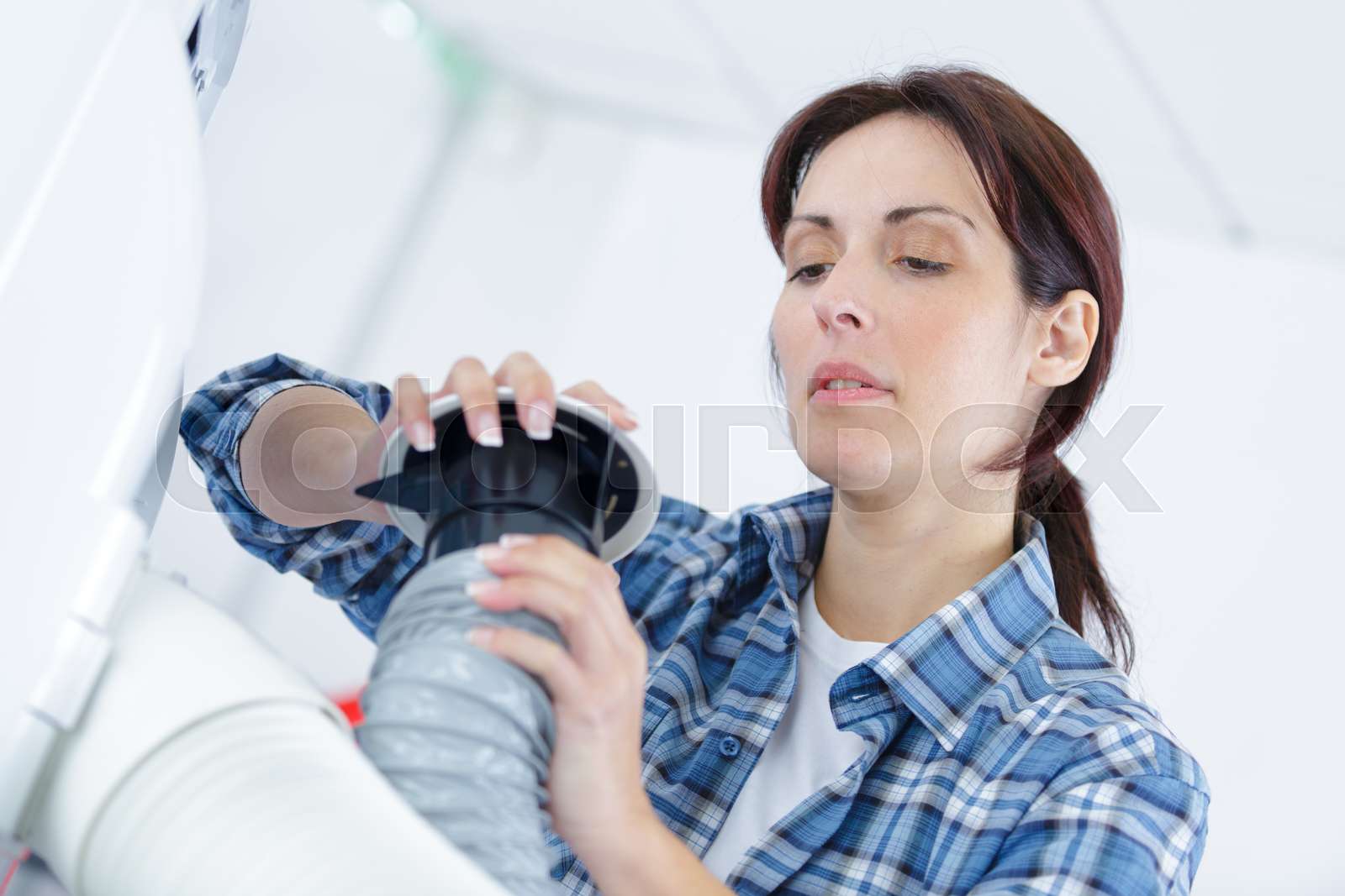 Female Repairer Fixing A Broken Ventilation Stack Stock Image Colourbox Female Repairer Fixing A Broken Ventilation Stack Stock Image Colourbox