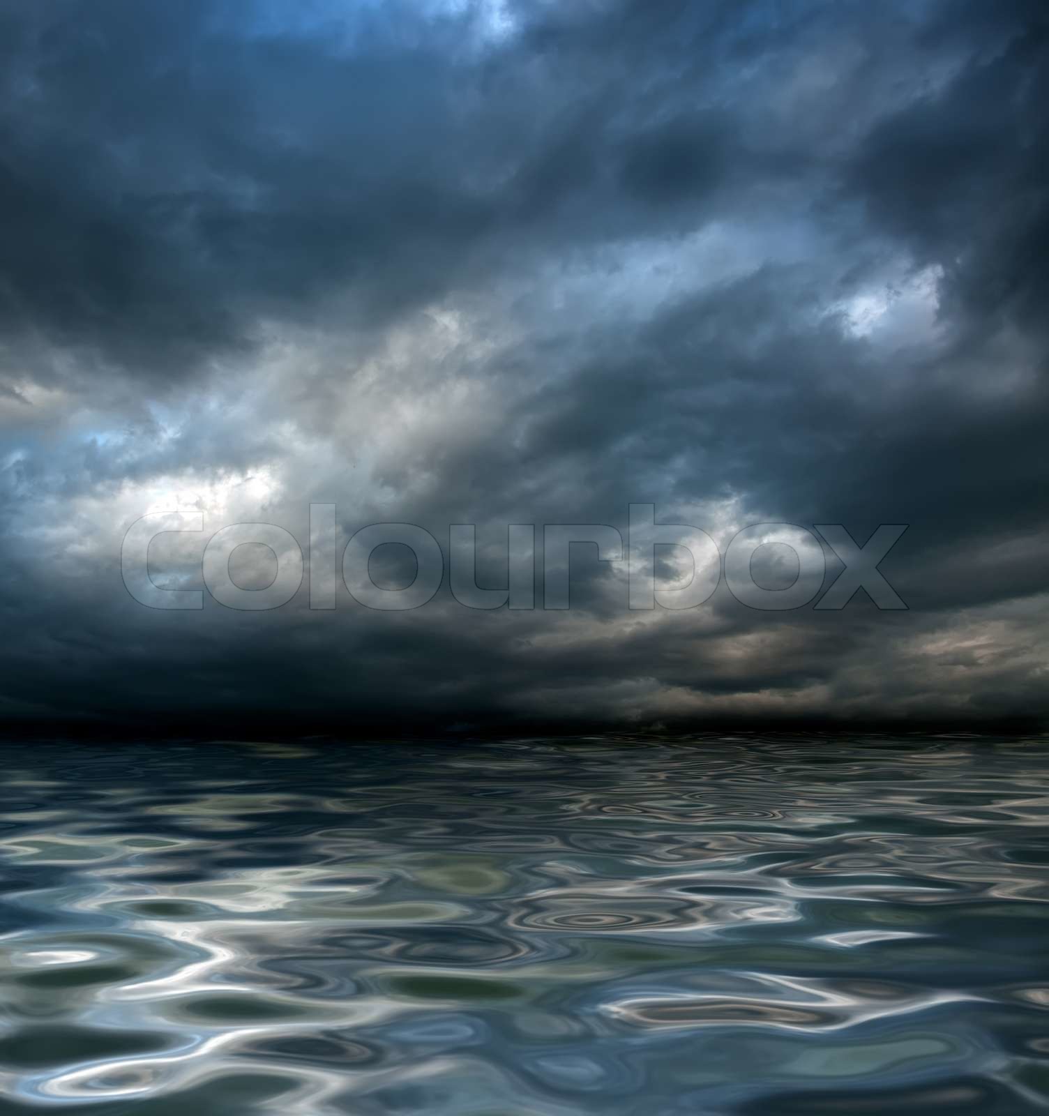 dark cloudy stormy sky with clouds and waves in the sea - global ...