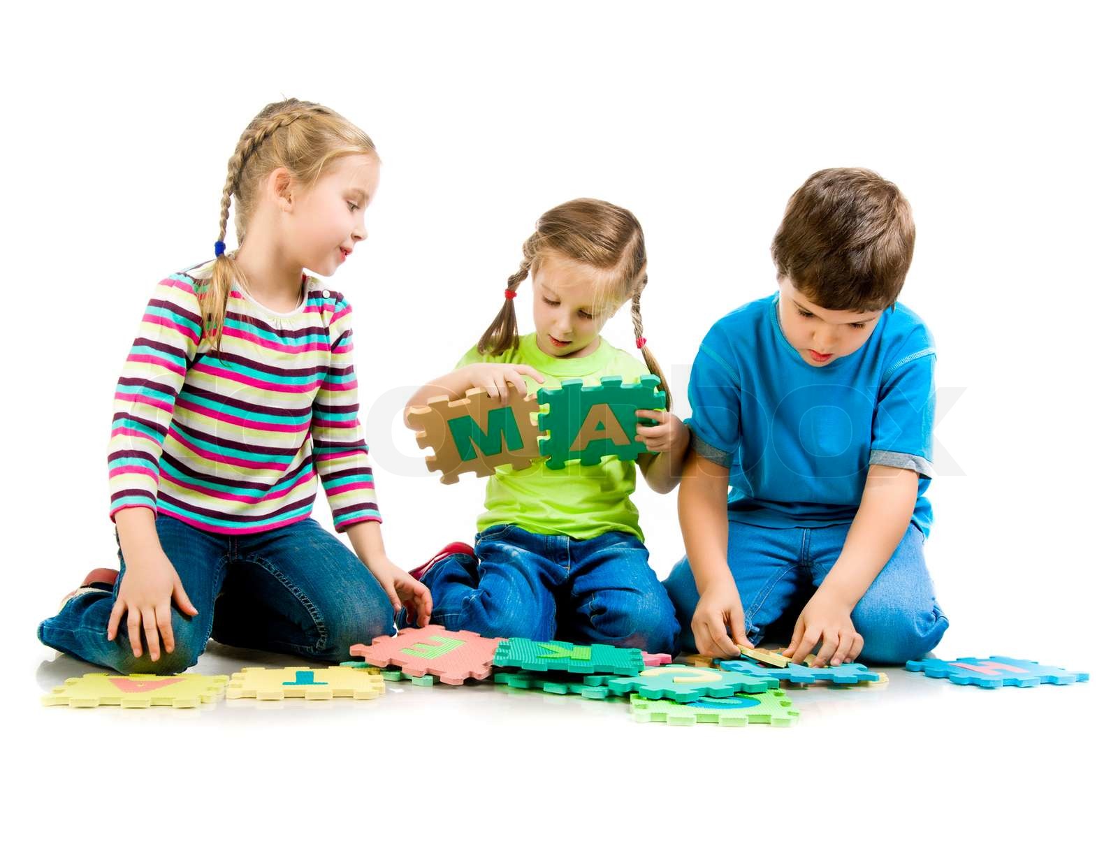 children are playing letters on the white background | Stock image