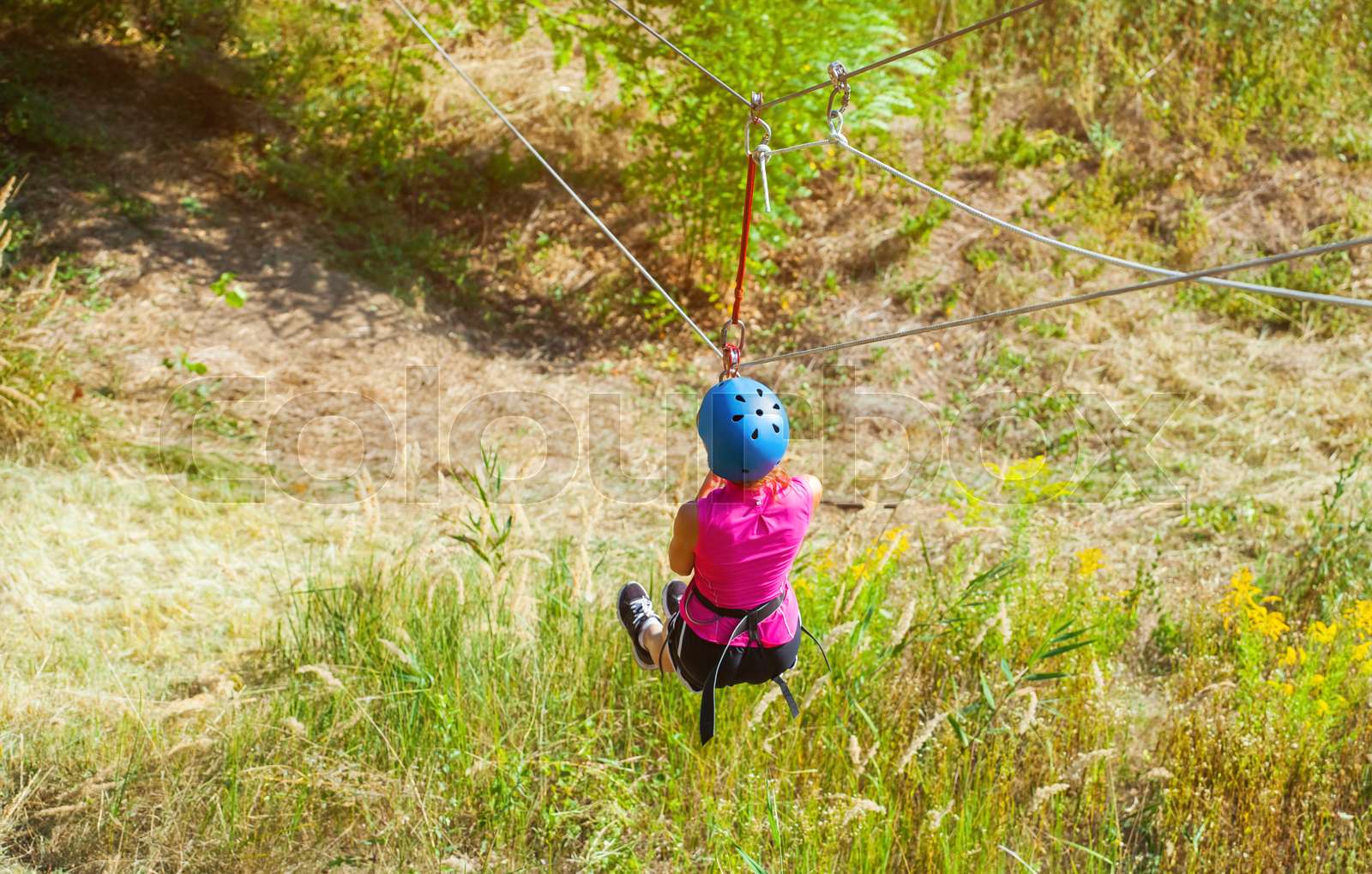 A Girl Is Making A Descent On A Rope From A Mountain Sport climbing And