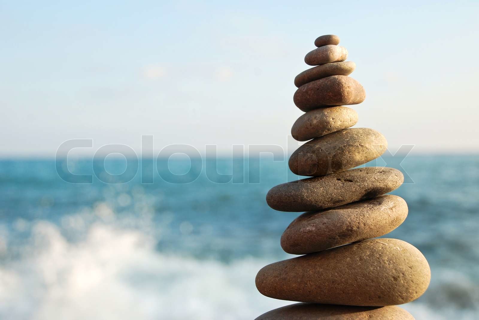 Stone tower on a pebble beach | Stock image | Colourbox