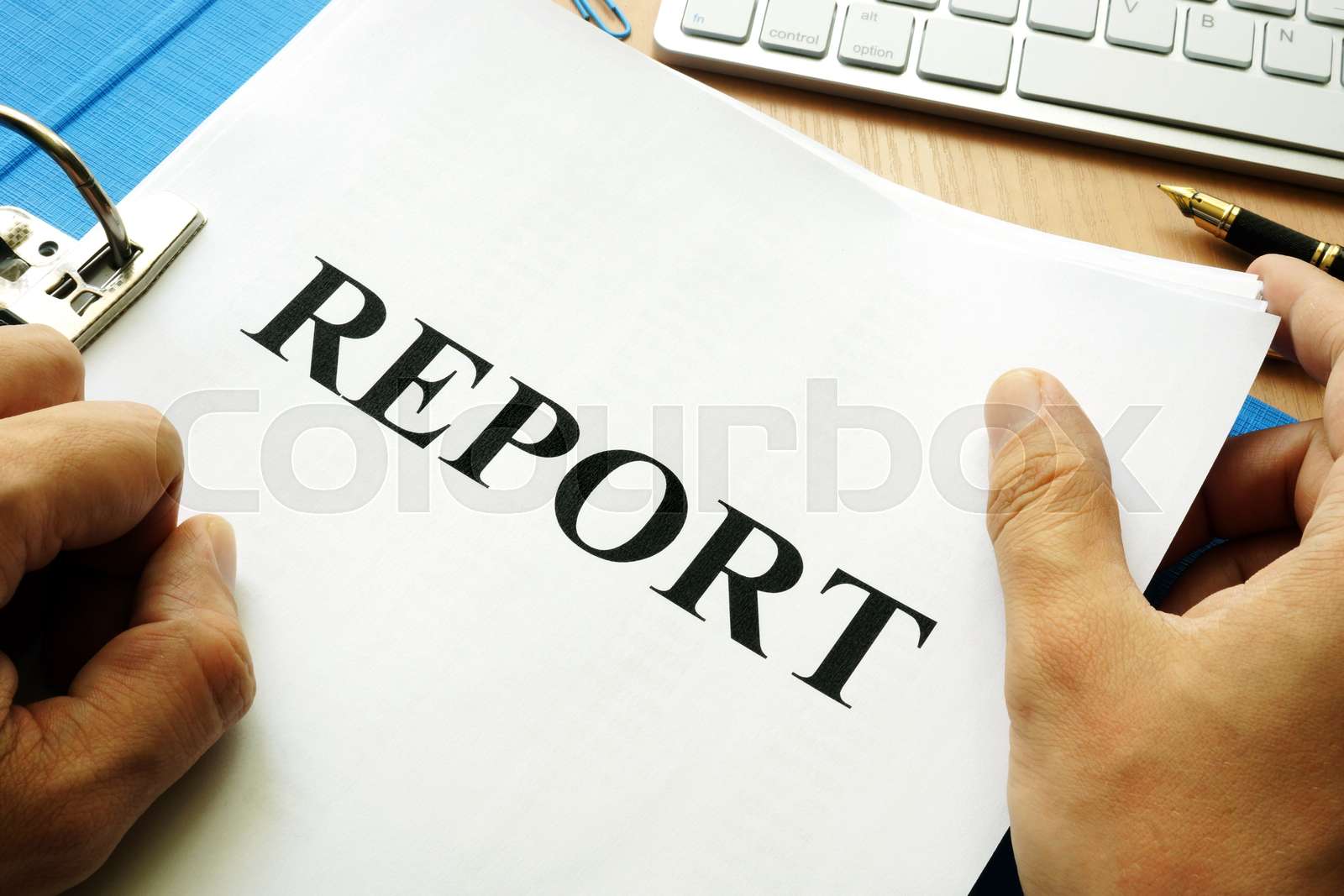 Folder and papers with title report. | Stock image | Colourbox