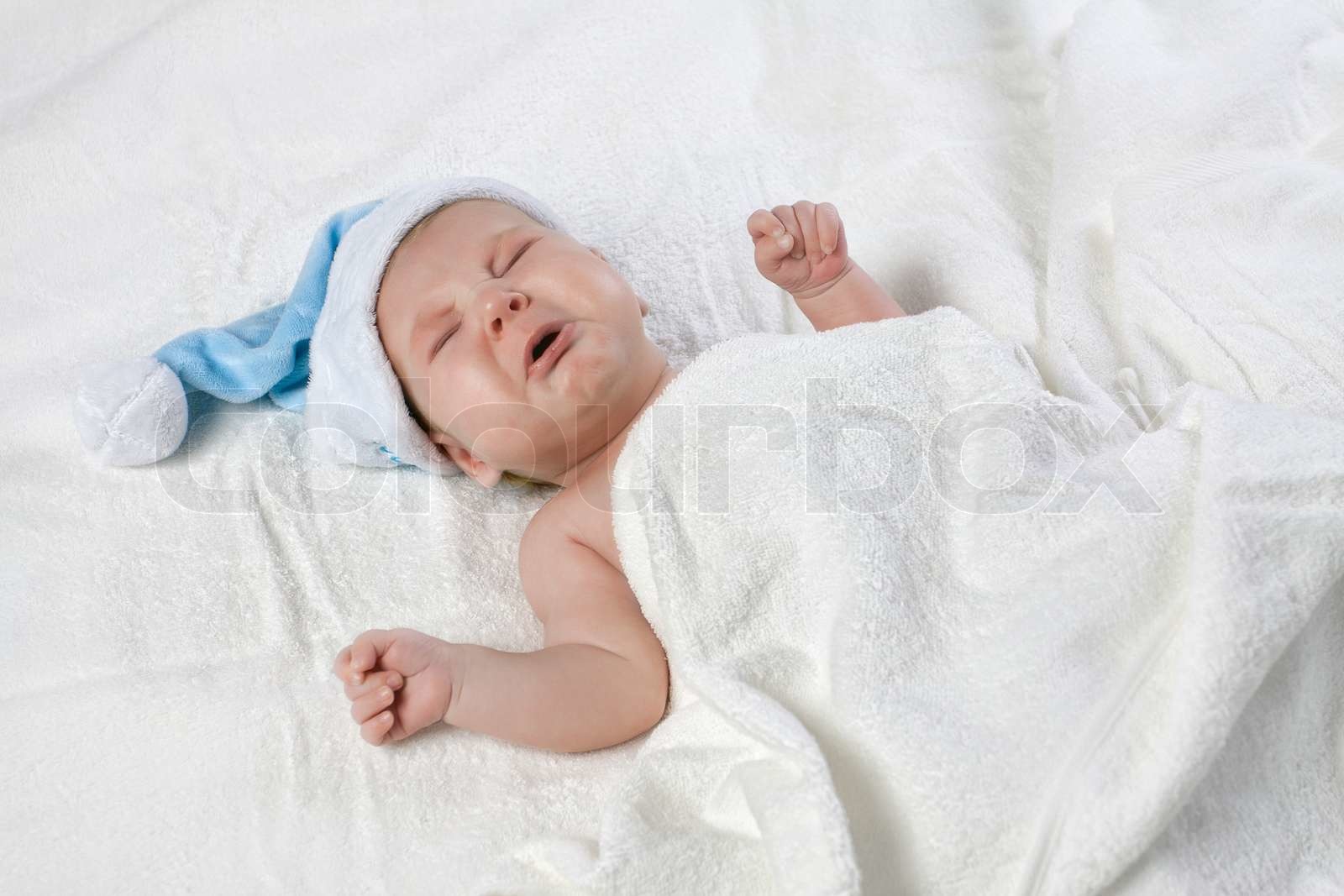 Crying Baby With Blue Cap Stock Image Colourbox Crying Baby With Blue Cap Stock Image Colourbox
