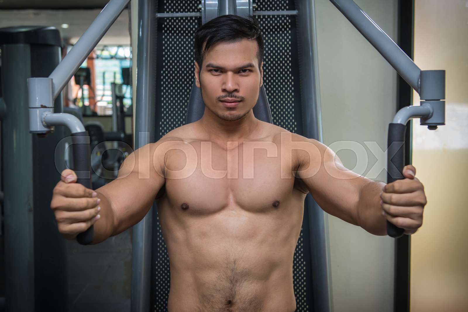 personal fitness trainer show his muscles or Strong bald bodybuilder ...