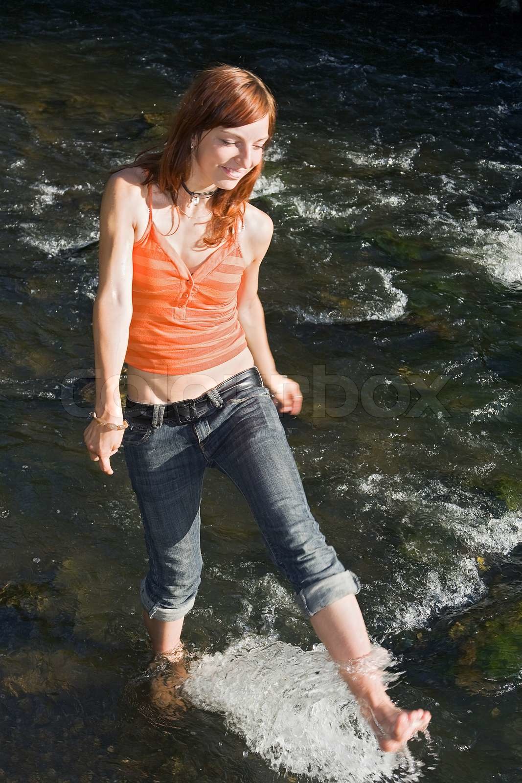 Girl squirts water | Stock image | Colourbox