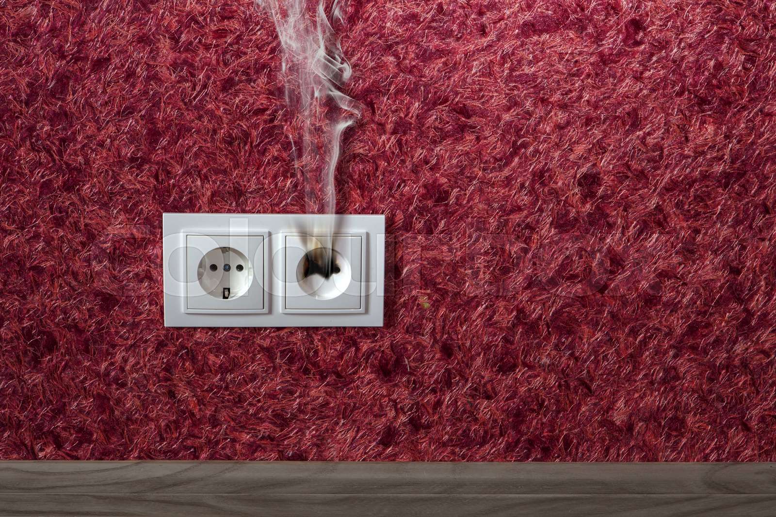 burned standard electrical outlet | Stock image | Colourbox
