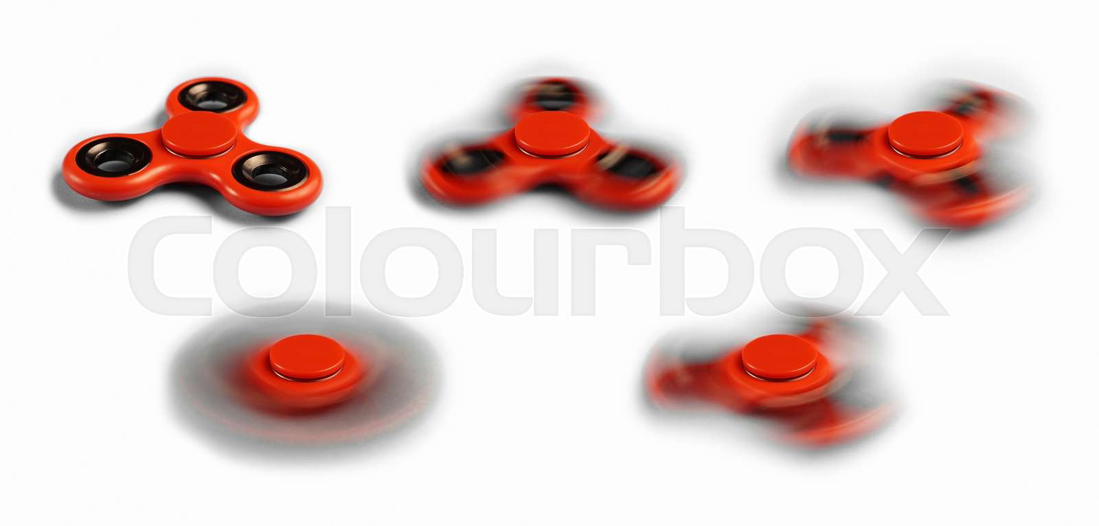 Fidget spinner in different various spinning speeds Stock image
