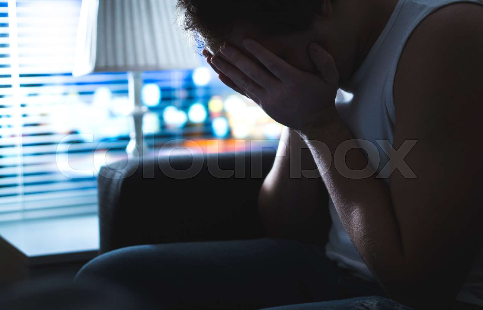 Sad And Unhappy Man Covering Face With Hands In Dark By Window Burnout Overwork Or Bankruptcy 