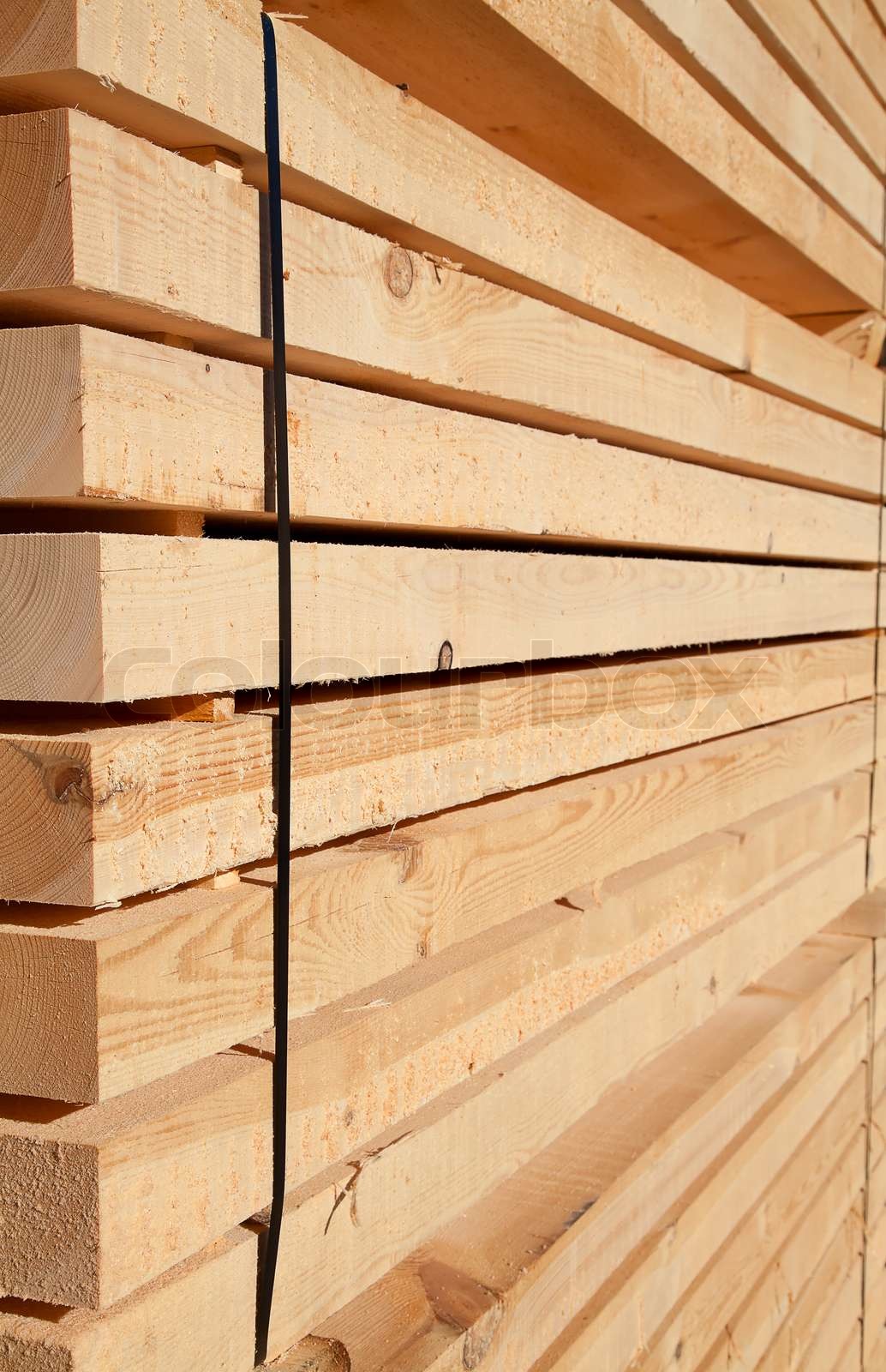Stack of new wooden studs at the lumber yard | Stock image | Colourbox