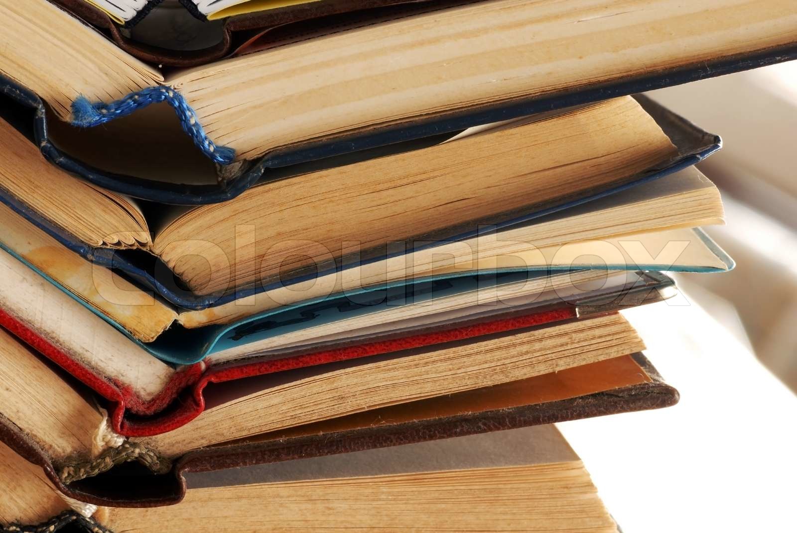 old dusty opened books stack on table Stock image Colourbox