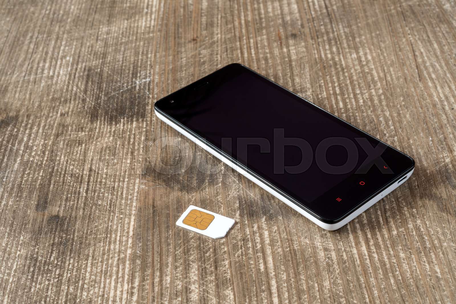Smartphone and SIM card | Stock image | Colourbox