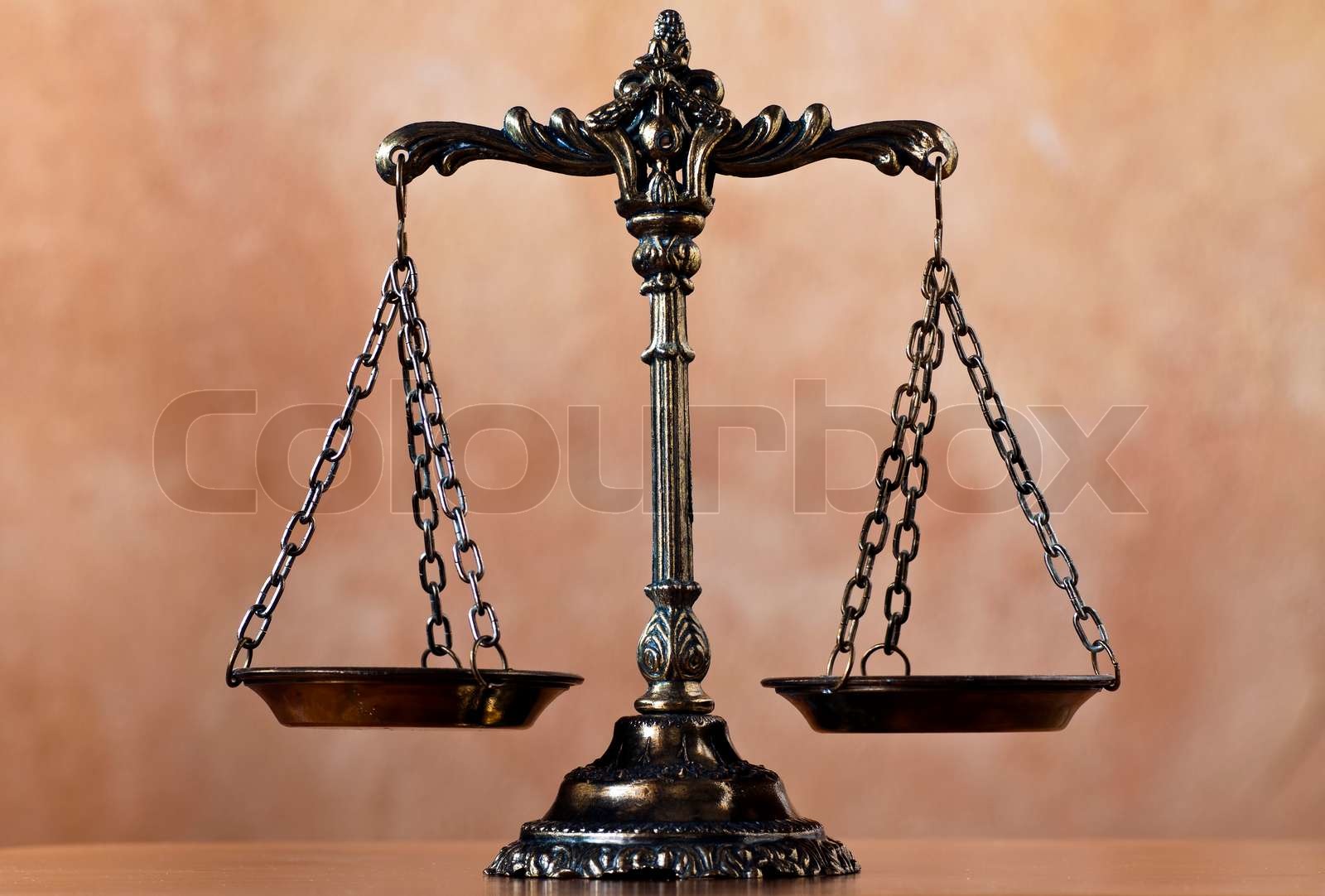 A photo of the scales of justice with a balance theme overlay | Stock